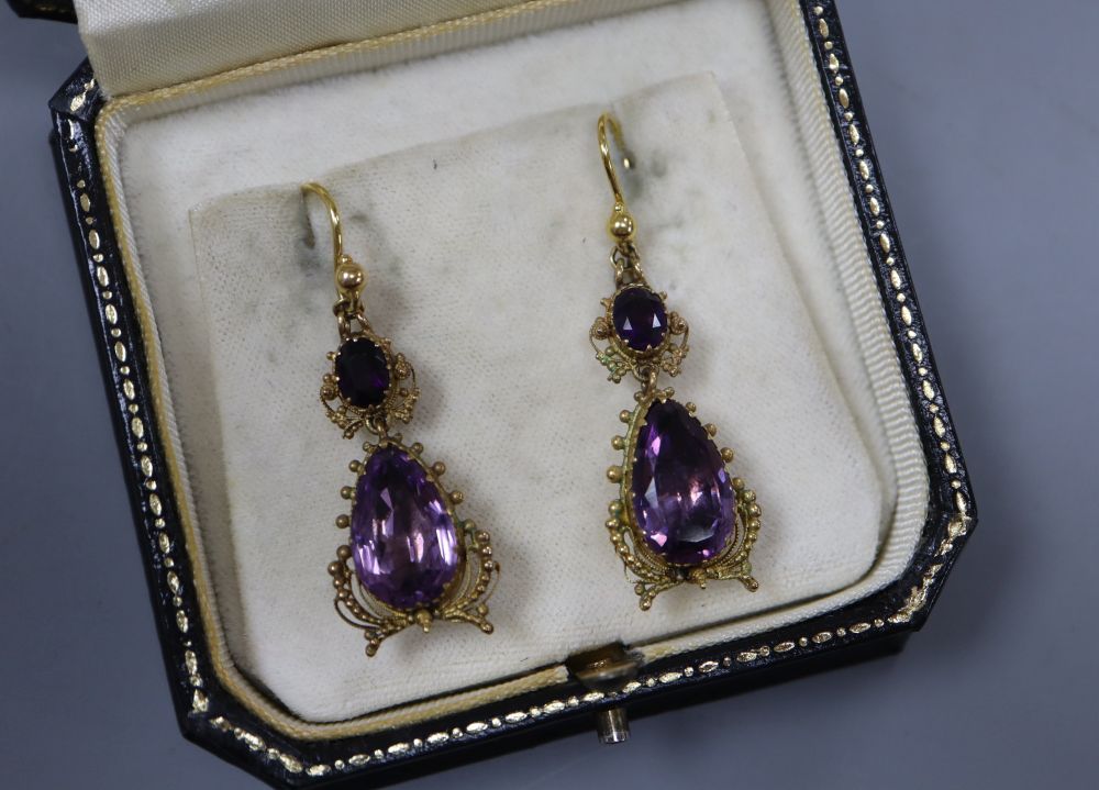 A pair of Victorian yellow metal and two stone amethyst set drop earrings, 38mm ex. ear wire, gross 7.8 grams.